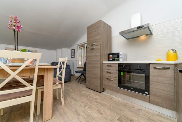 Apartment Aleks 1 Located in attractive location surrounded by flowers apartment for 2 people.