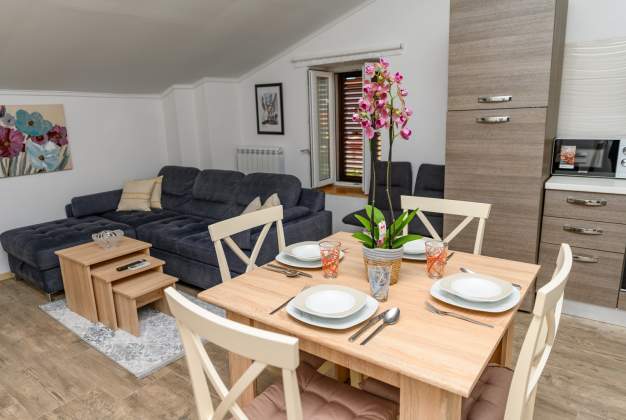 Apartment Aleks 1 Located in attractive location surrounded by flowers apartment for 2 people.