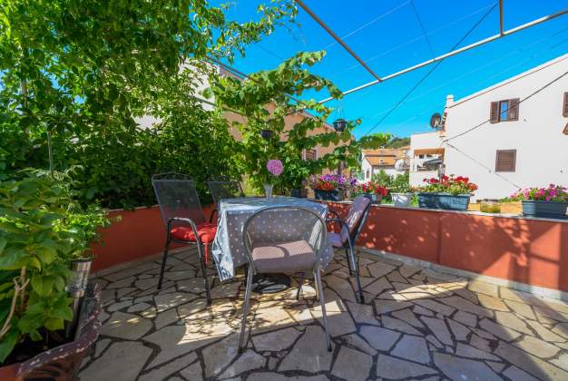 Apartment Aleks 1 Located in attractive location surrounded by flowers apartment for 2 people.