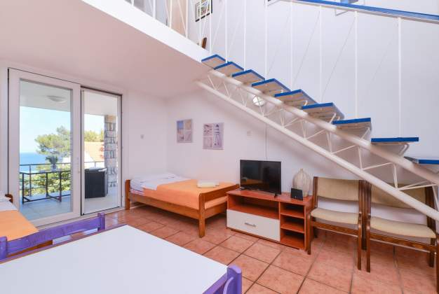 Apartment  Vitorio 3 - located by the beach of Vladarka Bay for 3 people in Mali Lošinj, Croatia.